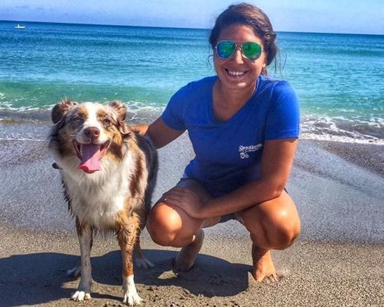 Trainer and the dog at the beach